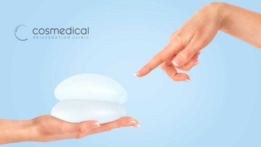 woman holding breast implants