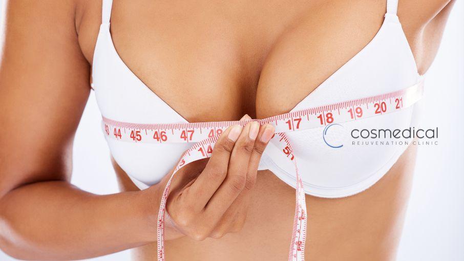 woman measuring breast size